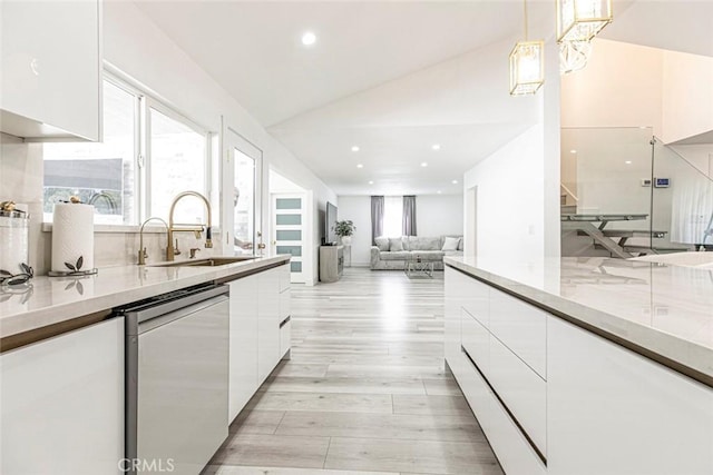 23500 Lloyd Houghton Pl, Newhall, CA 91321 - kitchen featuring stainless steel dishwasher, white cabinetry, modern cabinets, light wood-style floors, and recessed lighting