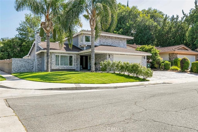 23500 Lloyd Houghton Pl, Newhall, CA 91321 - view of front of property featuring stone siding, concrete driveway, a garage, and a chimney