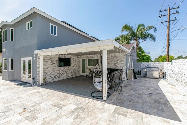 23500 Lloyd Houghton Pl, Newhall, CA 91321 - rear view of property featuring french doors, a patio area, a fenced backyard, and stucco siding