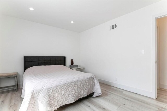 23500 Lloyd Houghton Pl, Newhall, CA 91321 - bedroom with wood finished floors and recessed lighting