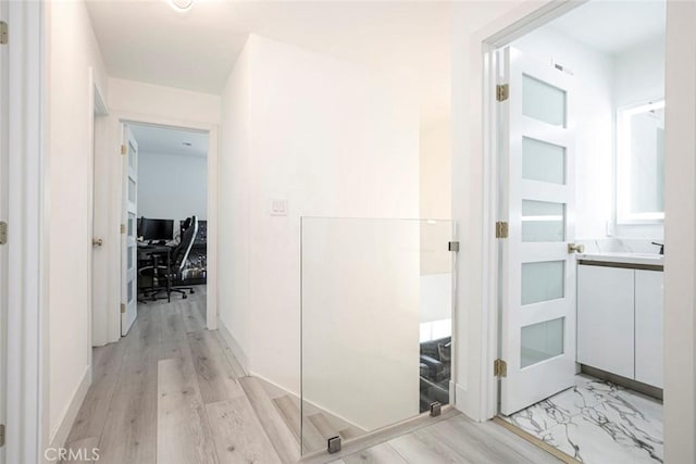 23500 Lloyd Houghton Pl, Newhall, CA 91321 - corridor with an office area and light wood finished floors
