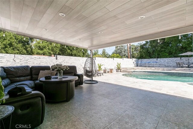 23500 Lloyd Houghton Pl, Newhall, CA 91321 - fenced backyard with a patio and outdoor lounge area