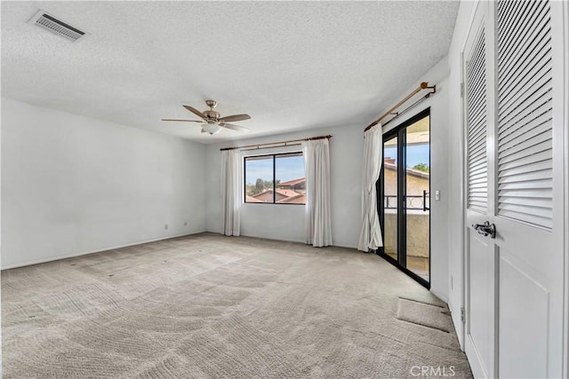 204 Hawk Ln, Palmdale, CA 93551 - empty room with light colored carpet, a textured ceiling, and a ceiling fan