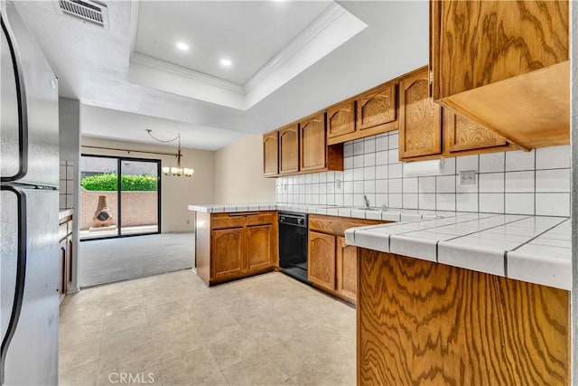 204 Hawk Ln, Palmdale, CA 93551 - kitchen with freestanding refrigerator, crown molding, a raised ceiling, a peninsula, and dishwasher