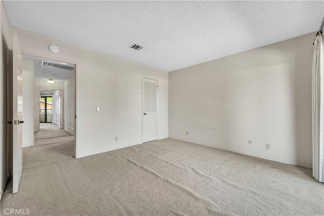 204 Hawk Ln, Palmdale, CA 93551 - unfurnished bedroom featuring light colored carpet and a textured ceiling