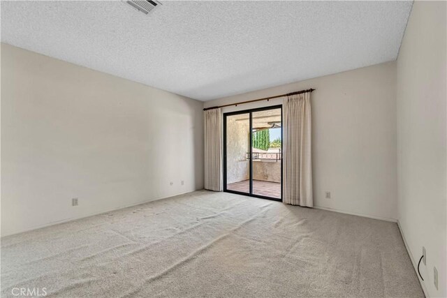 204 Hawk Ln, Palmdale, CA 93551 - carpeted empty room featuring a textured ceiling