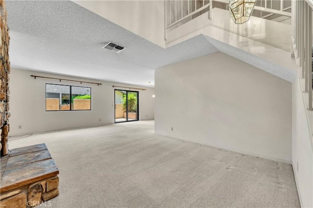 204 Hawk Ln, Palmdale, CA 93551 - unfurnished living room featuring light colored carpet and a textured ceiling