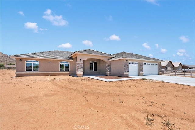 20020 Symeron Rd, Apple Valley, CA 92307 - single story home featuring a garage, concrete driveway, stone siding, and stucco siding