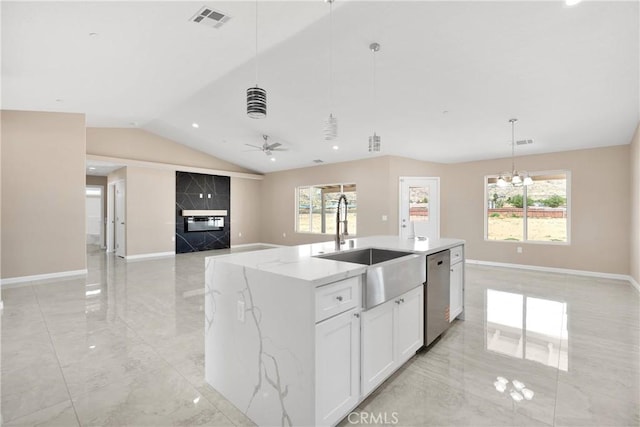 20020 Symeron Rd, Apple Valley, CA 92307 - kitchen with vaulted ceiling, stainless steel dishwasher, light marble finish floors, hanging light fixtures, and ceiling fan