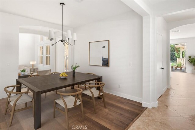 967 Strawberry Creek St, Chula Vista, CA 91913 - dining room featuring arched walkways and a chandelier