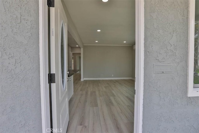 5021 Harbor St, Commerce, CA 90040 - hallway with recessed lighting, wood finished floors, and crown molding