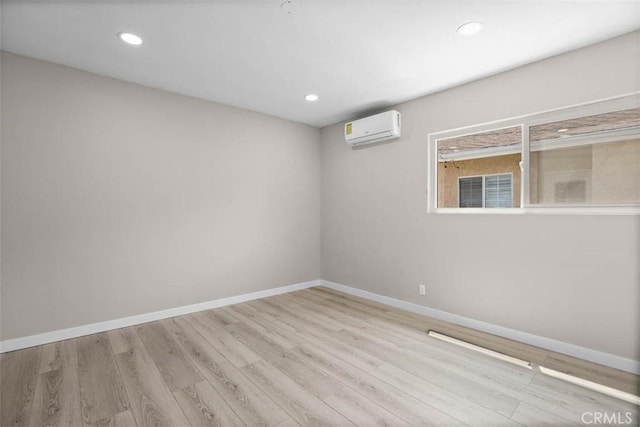 5021 Harbor St, Commerce, CA 90040 - spare room featuring a wall mounted air conditioner, wood finished floors, and recessed lighting