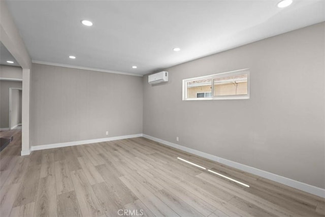 5021 Harbor St, Commerce, CA 90040 - unfurnished room with a wall mounted air conditioner, wood finished floors, recessed lighting, and ornamental molding