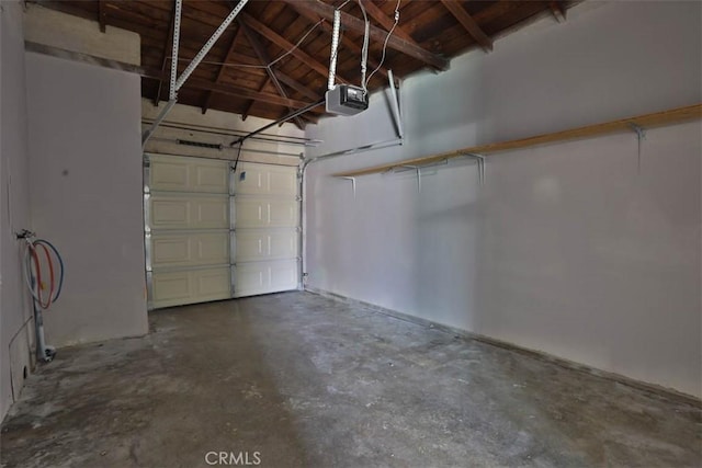 5021 Harbor St, Commerce, CA 90040 - garage featuring a garage door opener and wood ceiling