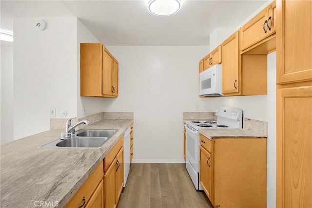 2521 W Sunflower Ave Unit R8, Santa Ana, CA 92704 - kitchen with white appliances, wood finished floors, and light countertops