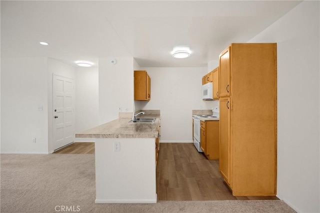 2521 W Sunflower Ave Unit R8, Santa Ana, CA 92704 - kitchen with white appliances, a peninsula, light countertops, recessed lighting, and dark wood-style floors