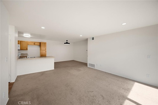 2521 W Sunflower Ave Unit R8, Santa Ana, CA 92704 - unfurnished living room with carpet floors and recessed lighting
