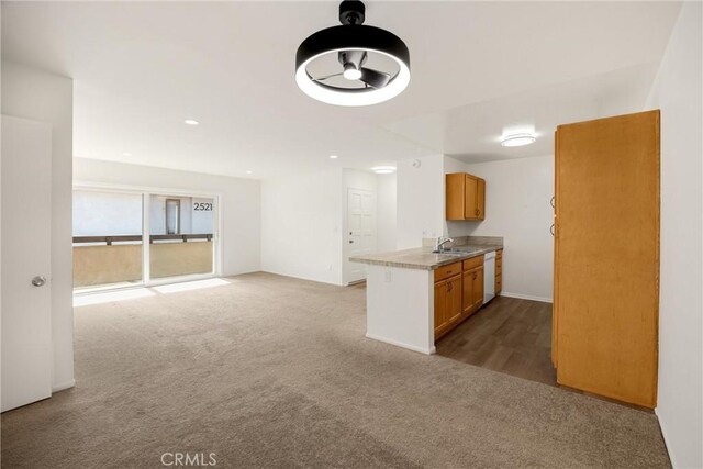 2521 W Sunflower Ave Unit R8, Santa Ana, CA 92704 - kitchen with white dishwasher, carpet floors, open floor plan, brown cabinets, and recessed lighting