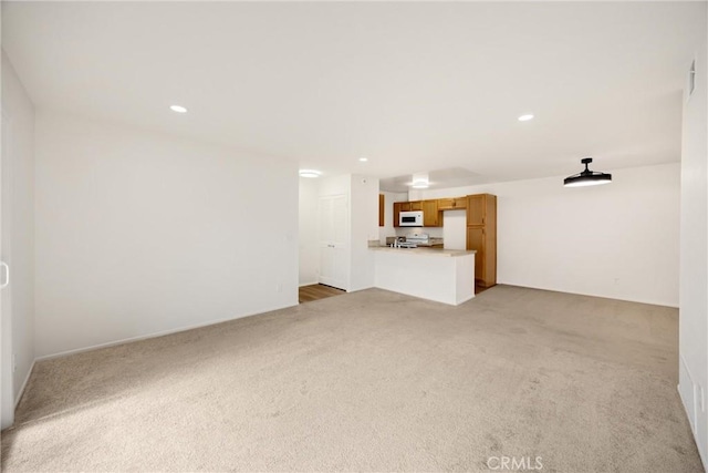 2521 W Sunflower Ave Unit R8, Santa Ana, CA 92704 - unfurnished living room with light carpet and recessed lighting