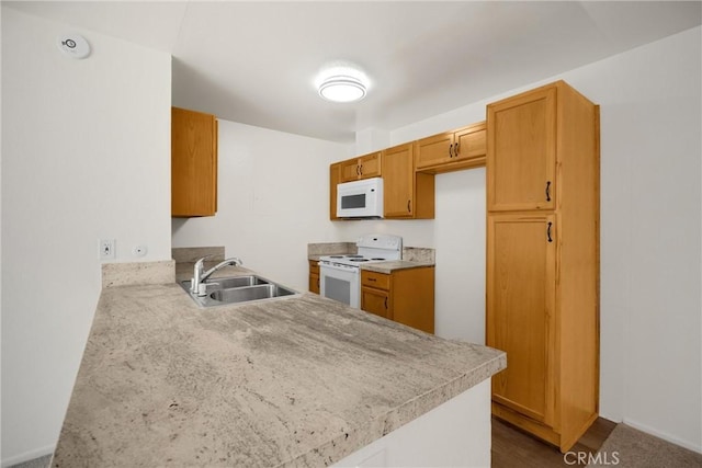 2521 W Sunflower Ave Unit R8, Santa Ana, CA 92704 - kitchen with white appliances, a peninsula, light countertops, and brown cabinets