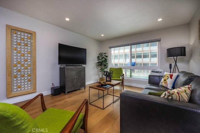 5585 E Pacific Coast Unit 141, Long Beach, CA 90804 - living room featuring light wood-style flooring and recessed lighting