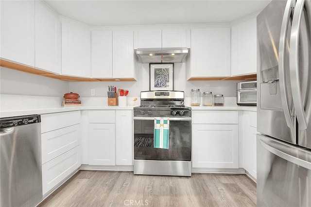 1068 Border Ave, Corona, CA 92882 - kitchen featuring appliances with stainless steel finishes, light countertops, and white cabinets