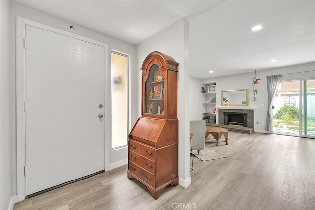1068 Border Ave, Corona, CA 92882 - entryway featuring light wood-style floors, recessed lighting, and a fireplace