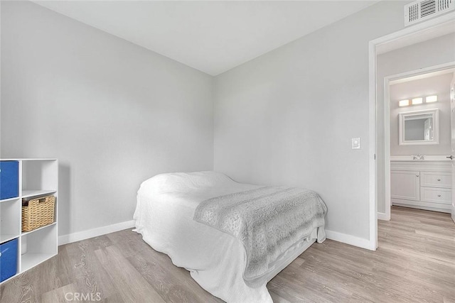 1068 Border Ave, Corona, CA 92882 - bedroom with light wood-style flooring and baseboards