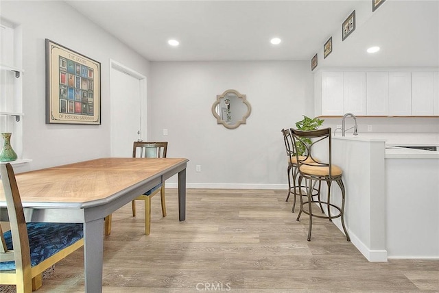 1068 Border Ave, Corona, CA 92882 - dining area with light wood-style flooring and recessed lighting
