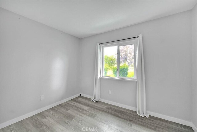 1068 Border Ave, Corona, CA 92882 - unfurnished room featuring wood finished floors and baseboards