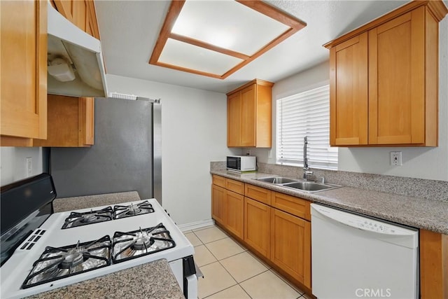 1657 E Kingsley Ave Unit B, Pomona, CA 91767 - kitchen featuring white appliances, under cabinet range hood, light tile patterned flooring, and light countertops