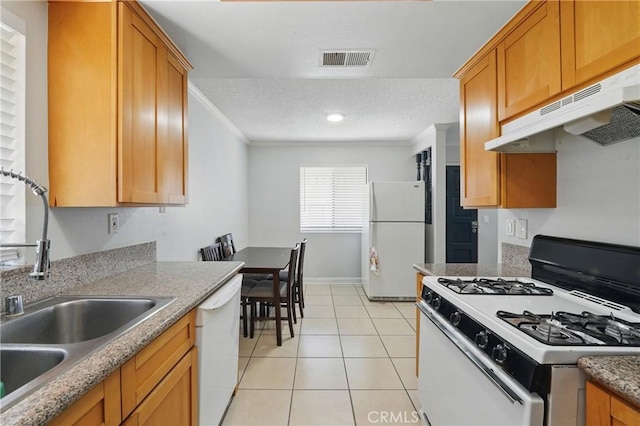 1657 E Kingsley Ave Unit B, Pomona, CA 91767 - kitchen featuring white appliances, under cabinet range hood, crown molding, light tile patterned floors, and a textured ceiling