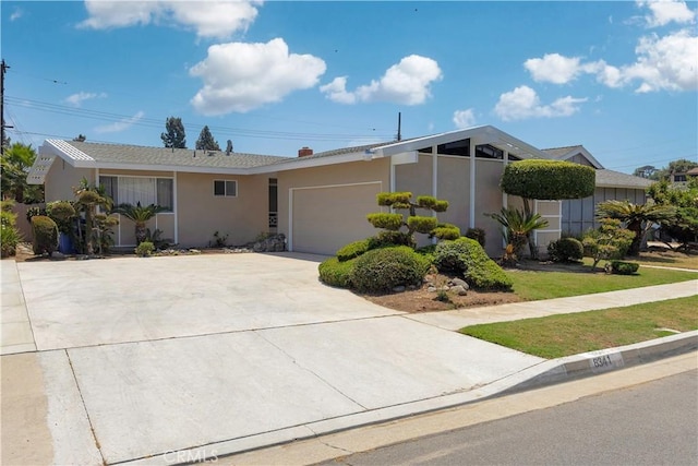 8341 Sierra Bonita Ave, Rosemead, CA 91770 - view of front of house with stucco siding, an attached garage, concrete driveway, and a front yard