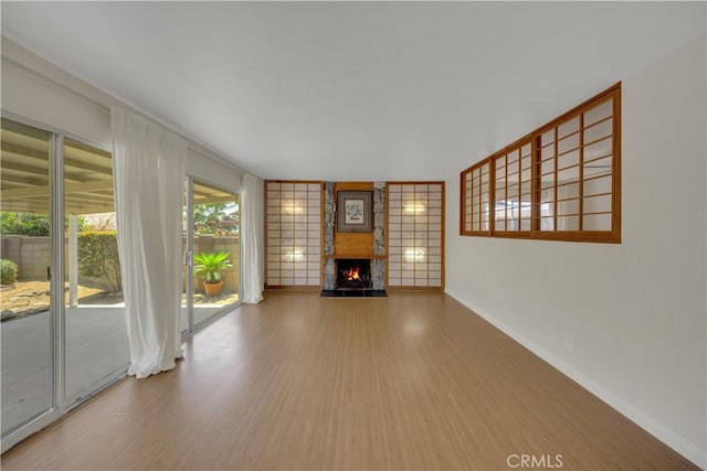 8341 Sierra Bonita Ave, Rosemead, CA 91770 - unfurnished living room with wood finished floors and a large fireplace
