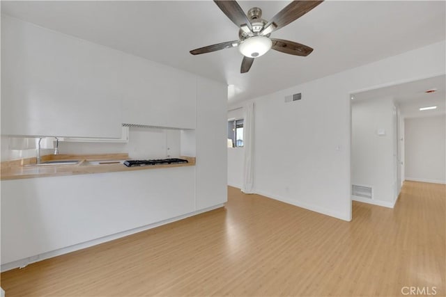8341 Sierra Bonita Ave, Rosemead, CA 91770 - unfurnished living room with light wood-type flooring and a ceiling fan