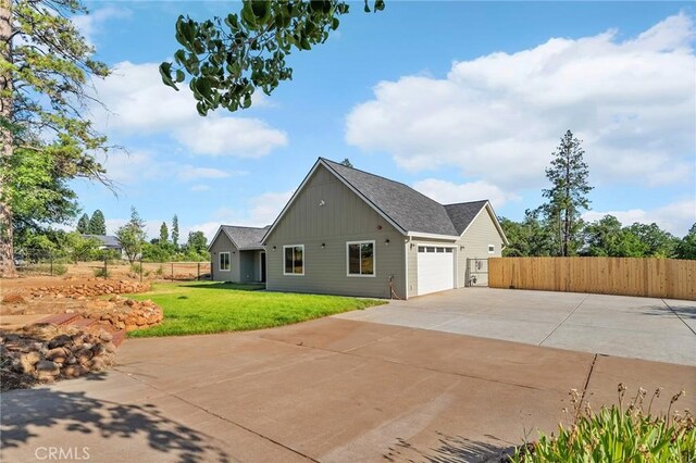 1340 Jeannie Ln, Paradise, CA 95969 - view of property exterior with a garage, board and batten siding, and driveway