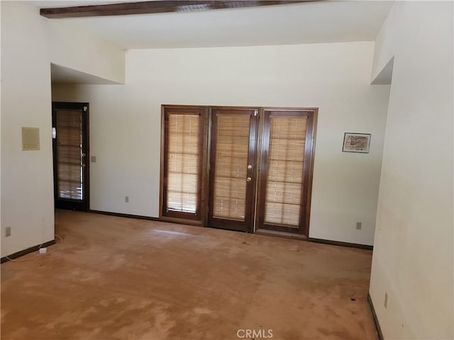 15440 Cactus St, Hesperia, CA 92345 - empty room featuring carpet flooring and beam ceiling
