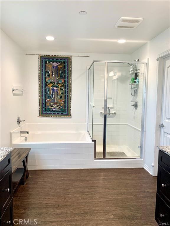 28667 Clearview St, Murrieta, CA 92563 - full bathroom with vanity, wood finished floors, a stall shower, a garden tub, and recessed lighting