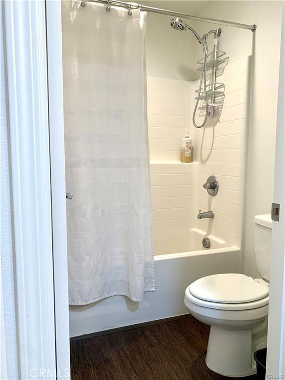 28667 Clearview St, Murrieta, CA 92563 - full bathroom featuring shower / bath combination with curtain and wood finished floors