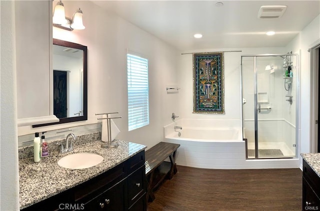 28667 Clearview St, Murrieta, CA 92563 - bathroom featuring vanity, a stall shower, wood finished floors, a bath, and recessed lighting