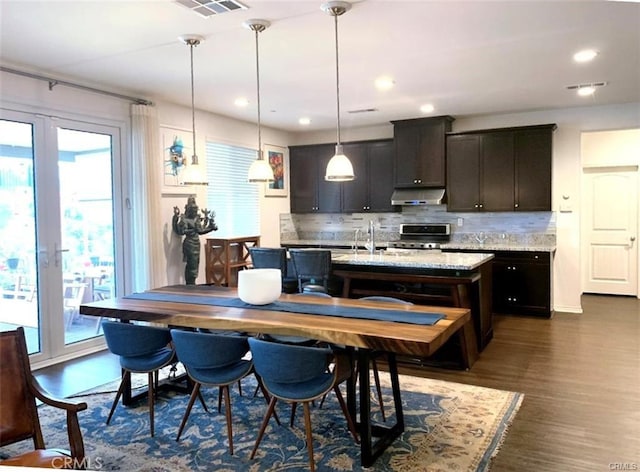 28667 Clearview St, Murrieta, CA 92563 - dining area with french doors, dark wood finished floors, and recessed lighting