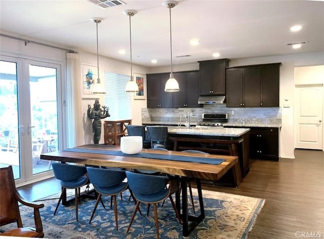 28667 Clearview St, Murrieta, CA 92563 - dining space with french doors, dark wood finished floors, and recessed lighting