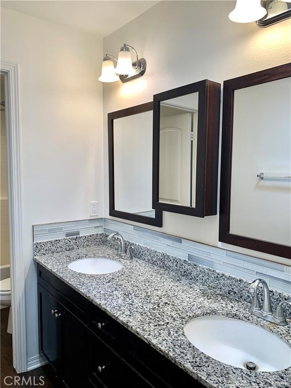28667 Clearview St, Murrieta, CA 92563 - full bathroom featuring double vanity and toilet