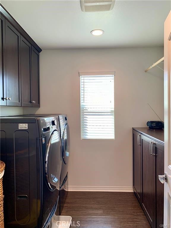 28667 Clearview St, Murrieta, CA 92563 - washroom featuring washer and clothes dryer, cabinet space, dark wood-style flooring, and recessed lighting