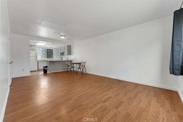 1553 Dennis Pl, West Covina, CA 91790 - unfurnished living room with light wood-style flooring