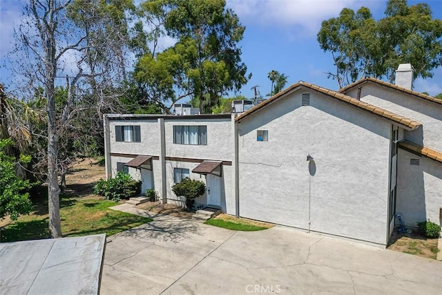 1553 Dennis Pl, West Covina, CA 91790 - view of front of property with a chimney and stucco siding