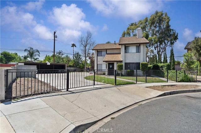 1553 Dennis Pl, West Covina, CA 91790 - view of front facade with a chimney, stucco siding, a fenced front yard, a tiled roof, and a gate