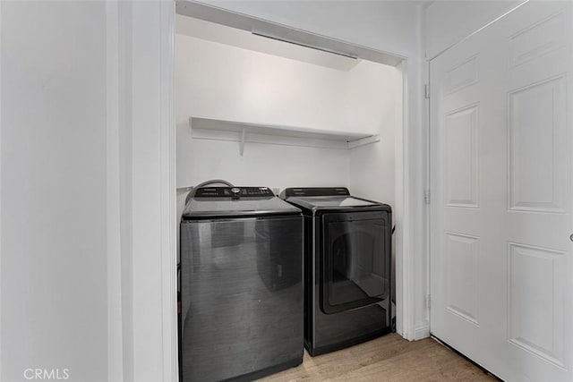 1553 Dennis Pl, West Covina, CA 91790 - laundry room with independent washer and dryer and light wood-type flooring