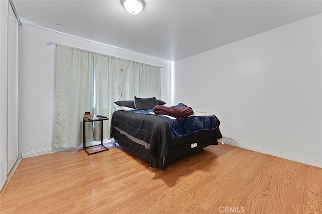 1553 Dennis Pl, West Covina, CA 91790 - bedroom with light wood-style floors and baseboards