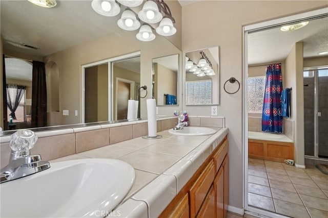 12671 Shorewood Ln, Victorville, CA 92392 - full bathroom with double vanity, a stall shower, and tile patterned flooring